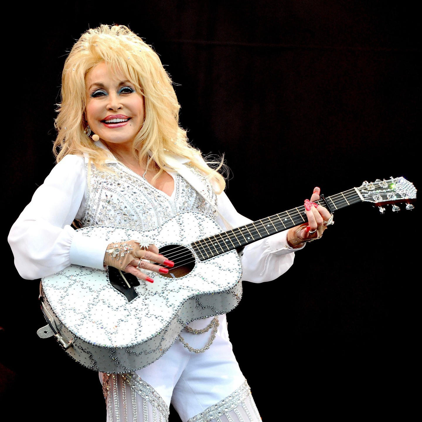 image  1 Vanities - Dolly Parton didn't mean to “stir up any controversy” with her recent entrée into the Roc
