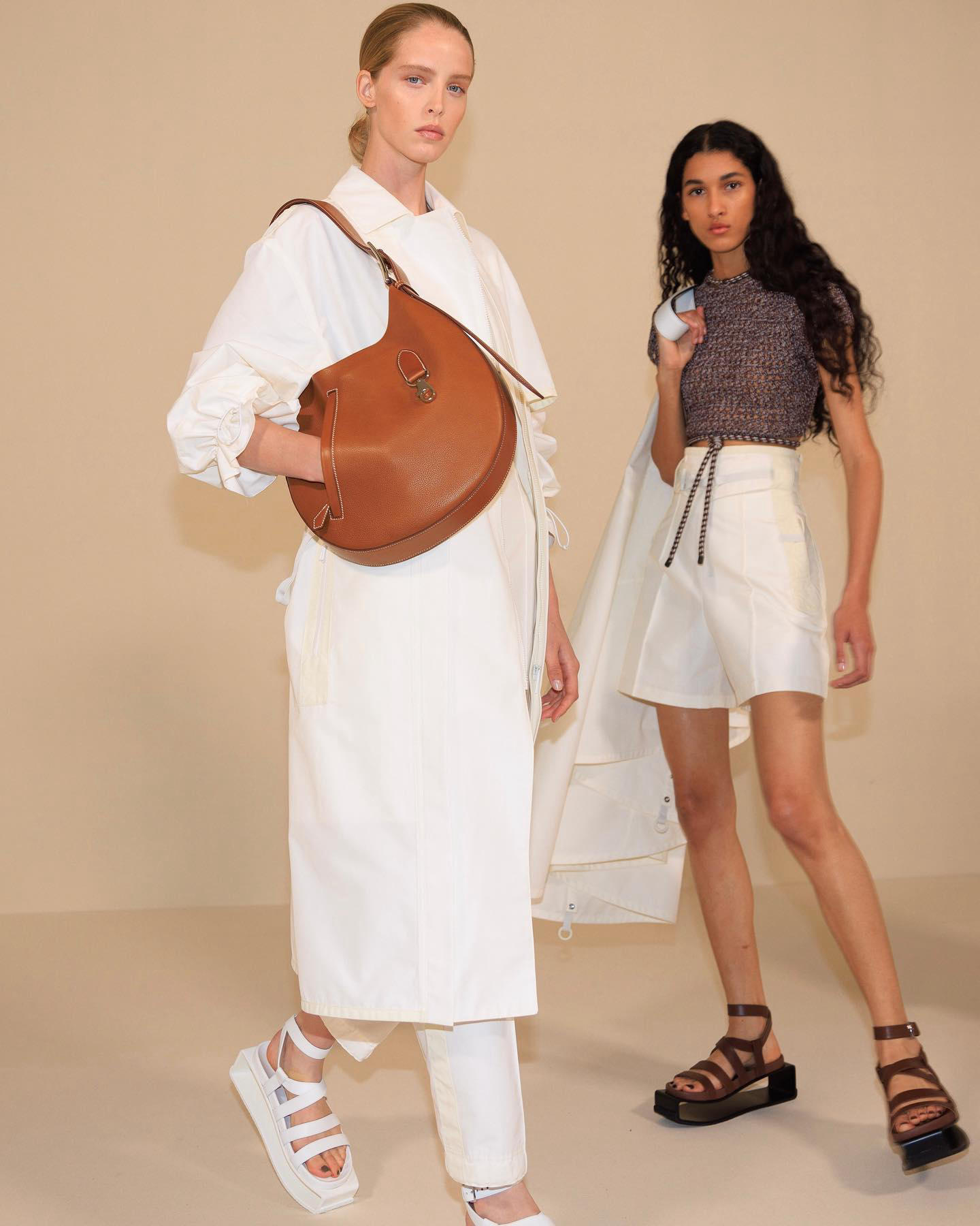 image  1 Vogue - Today at the Tennis Club de Paris, #hermes spring 2023 brought warm neutrals and abstract ge